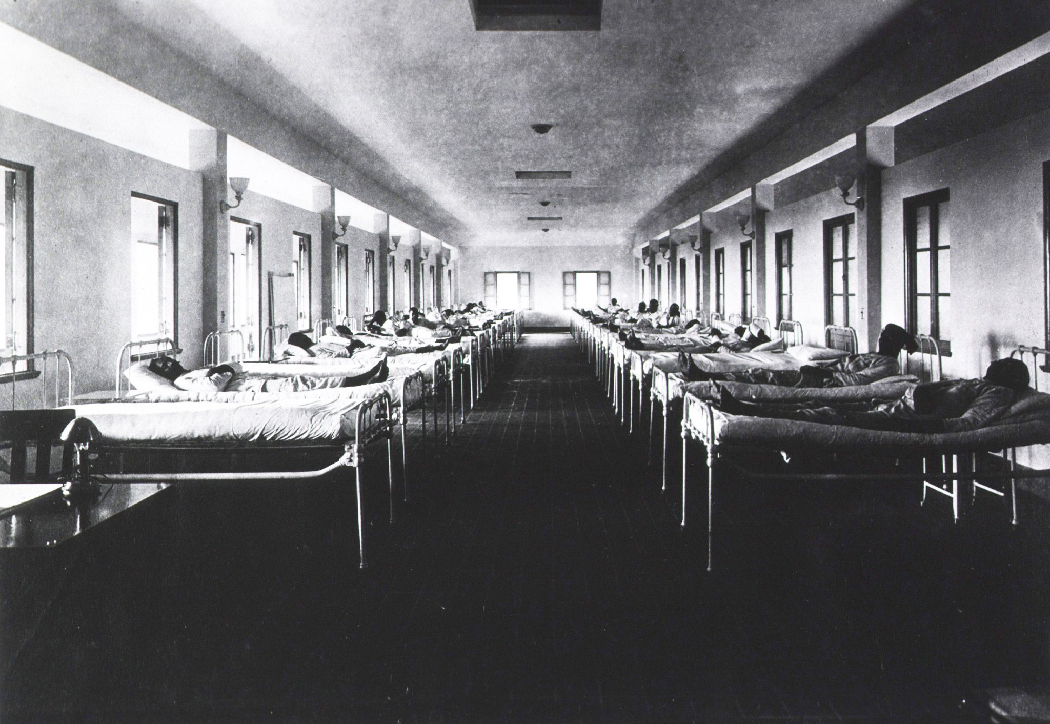 Black and white photo of a black-only hospital ward during the 1918 flu pandemic.