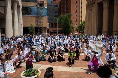 VCU Health team members kneel in support of Black Lives Matter to stand against racism.